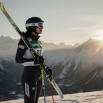 Bhavani Thekkada stands on a snow hill with a misty Italian sunrise lighting the mountains and her determined Olympic gaze.