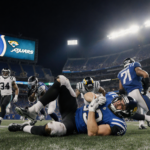 Daniel Jones clutching his football injury leg with teammates rushing and a bright stadium glow behind the field.