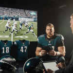 Greg Olsen and John Clark analyze Eagles game on tablet with studio lights and screen simulation