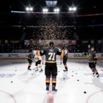Flyers captain in hockey holds arms outstretched while goalie reaches for puck and confetti swirls behind and Golden Knights