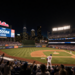 Kyle Schwarber stepping up to the plate with golden light and a roaring crowd in a dimly lit Phillies stadium