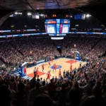 76ers celebrating victory at Madison Square Garden with a partially lit tunnel entrance and a sea of red‑jersey fans in the b