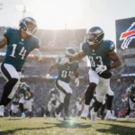 Eagles players stretching with A.J. Brown and Landon Dickerson under bright sun and Bills logo in background