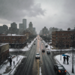 Stalled cars slide on slick streets with pedestrians huddled under umbrellas in snowy Philadelphia