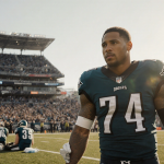 Saquon Barkley holding teammate