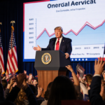 President Donald Trump speaking to crowd with American flag and growth graph behind him
