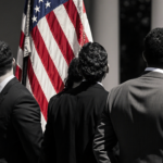 Three men standing with a faded American flag draped ahead symbolizing strained U.S.-Venezuela ties