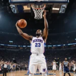 VJ Edgecombe releasing a winning basketball shot with the ball flying through the net and Sixers