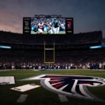 Fans gaze at split-screen replay of Falcons playoff loss with Falcons logo on field and abandoned clipboard on sideline