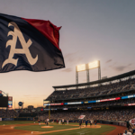 Fans cheering and holding flags with sunset lights over baseball stadium and waving pennant while players hold new gear