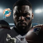 Christian Barmore standing with a broken helmet and shattered football on a dim field and blurred Dolphins logo in background