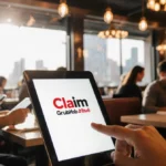 Tablet displaying Claim logo with busy diners typing on devices and warm lighting highlighting vibrant restaurant branding