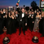 Hollywood celebrities celebrating on the red carpet with Golden Globe trophies and champagne while Netflix banners glow behin