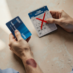 Couple holding health insurance card and calendar red X with bruised wrist against warm beige background