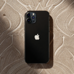 iPhone displaying its sleek design with richly patterned vintage Indian fabric background