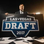 Raiders general manager standing behind draft board showing No.1 pick with scattered papers and coffee cups