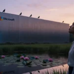 Young woman gazes up at glowing sustainable data center with rooftop birds and lily pond reflecting sunset