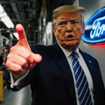 President Trump raising middle finger toward heckler with Ford logo on factory wall
