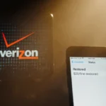 Faded Verizon logo hangs crookedly with glowing phone showing $20 account credit restoration and grid of restored screens